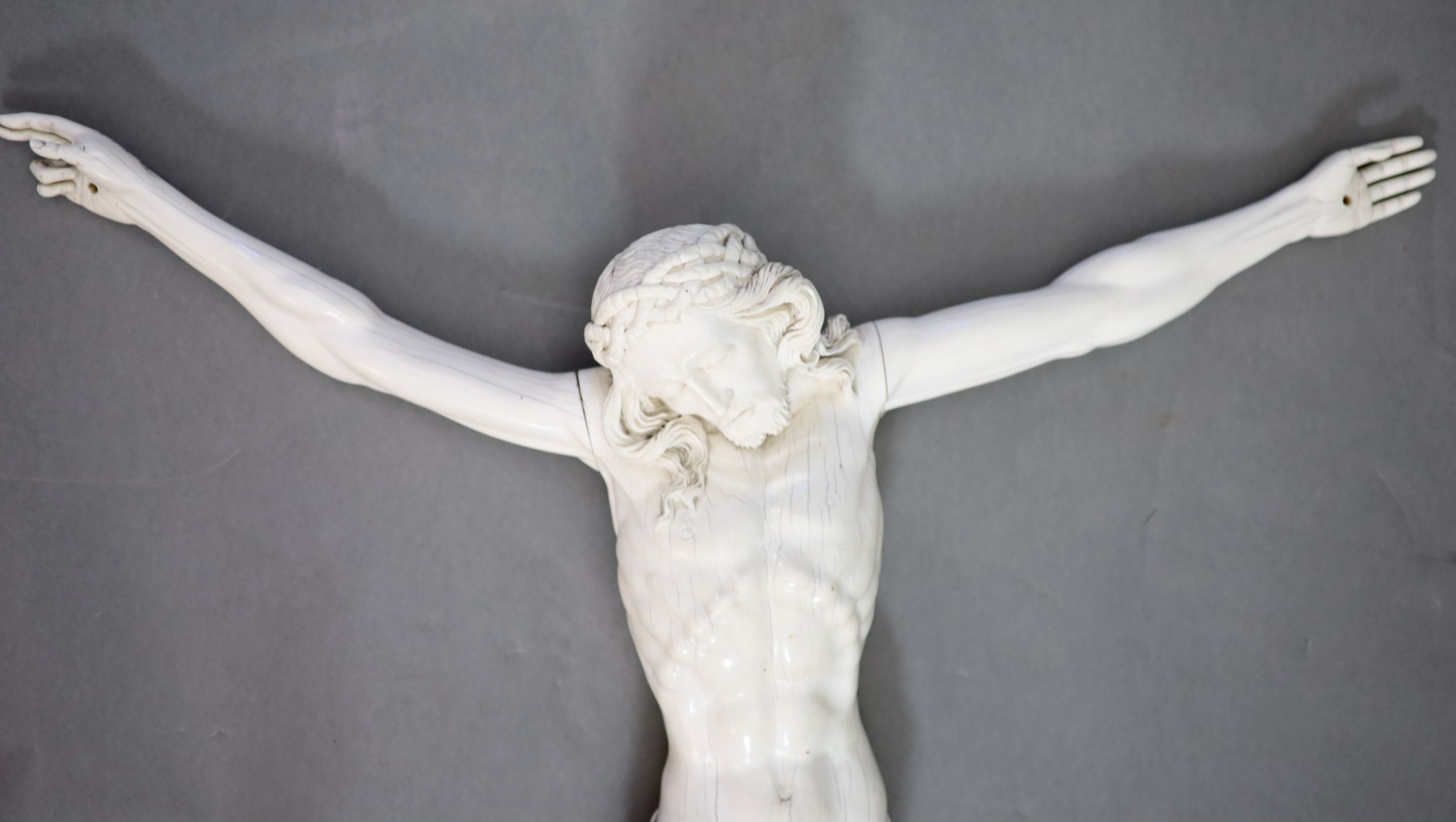 After Joseph Deutschmann (1717-1787) a very large German carved ivory Corpus Christi, 19th century 75cm wide, 75cm high.